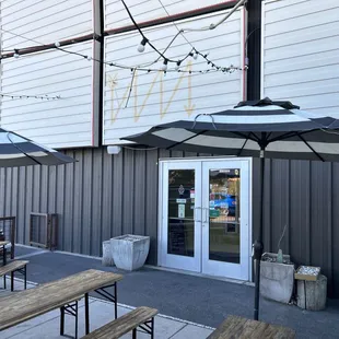 patio area with tables and umbrellas