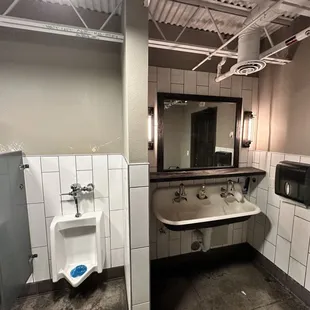 Mens restroom, needs maintenance, cleaning, paint.