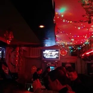 Dimly lit, cheery bar space