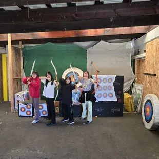 Family getting photos after their fun archery lessons!