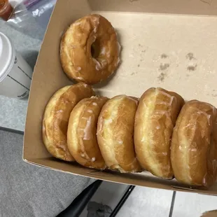 a box of glazed donuts