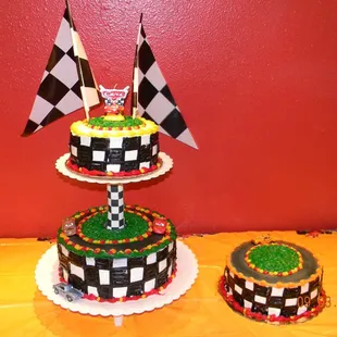 a three tiered cake with a racing theme