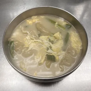 만두국. ManDooGuk. Dumpling soup in beef broth