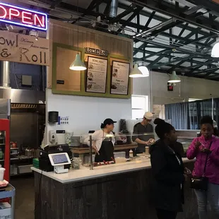 customers at the counter of a restaurant