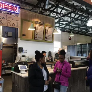 customers at the counter of a restaurant