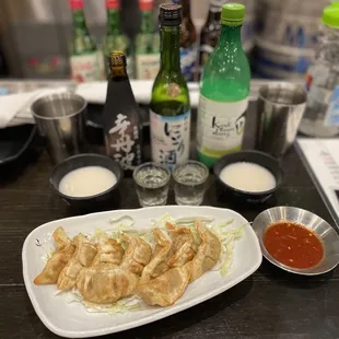 Fried potstickers, kook soon dang (Korean rice wine) sho chiku bai sake and karatanba sake