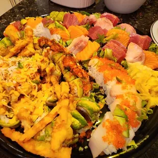 Disregard the yellow lighting. The 50/50 platter. Half sashimi, half rolls. $150 before tax.