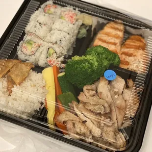 3 item bento. Salmon, chicken teriyaki (without the teriyaki sauce) and CA roll