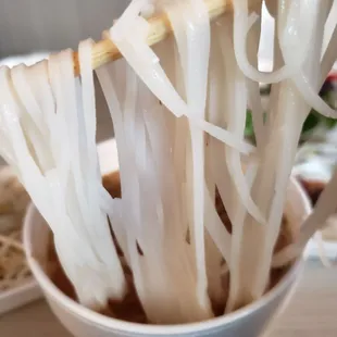 noodles in a bowl with chopsticks