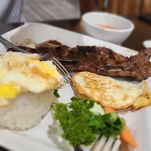 Grilled pork chop. It comes with an egg. We added an extra egg.