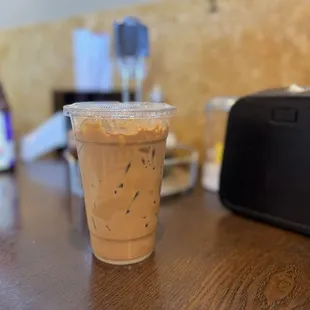 a plastic cup of iced coffee