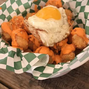 a fried egg on top of carrots