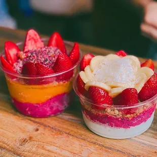 two bowls of fruit and yogurt