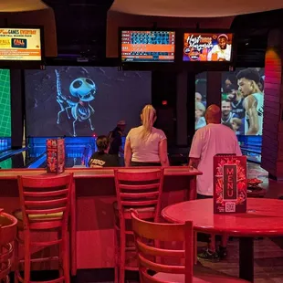 Seating behind the bowling lanes. There's plenty of it