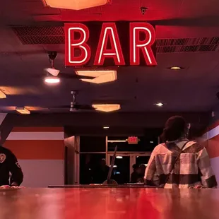 Inside. Bar is located at the left of all the lanes.