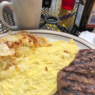 an omelet, steak and coffee