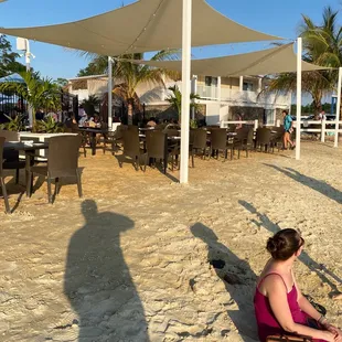 a boy and a girl playing in the sand