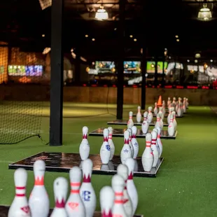 a row of bowling pins in a bowling alley