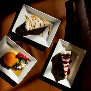 three plates of dessert on a table