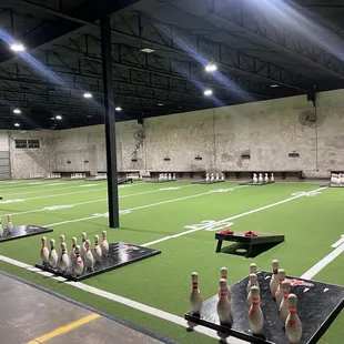 Cornhole and bowling pin toss game