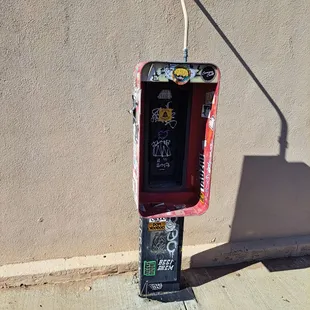 Old fashioned payphone but the Payphone is not in the case