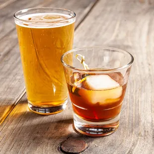 two glasses of beer on a wooden table