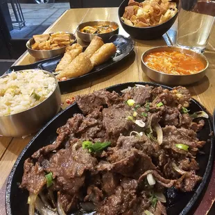 Bulgogi steak, wonton skins, egg rolls, kimchi, daikon radish, fried rice