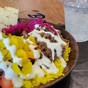 Lamb &amp; yellow rice bowl with garlic sauce