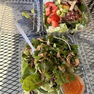 a salad and a salad in a plastic container
