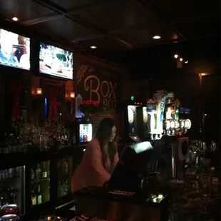 a woman sitting at a bar