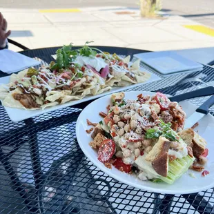 Background: lentil nachos; foreground: pizza salad.  Lentil nachos were solid, but the pizza salad was amazing.