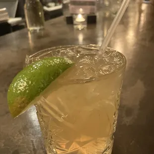 a drink with a lime slice on the rim