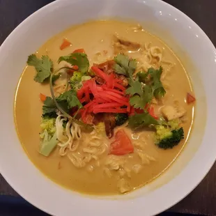 Curry tofu ramen (curry broth with ramen noodles, crispy tofu, broccoli, carrots, and red pepper).