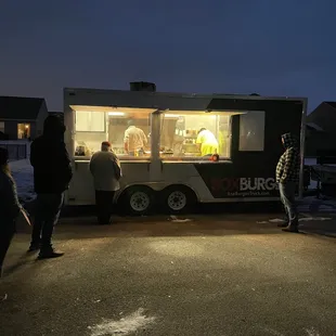 people ordering food from a food truck