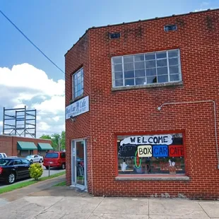 a brick building with a welcome sign