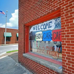 a welcome sign in the window