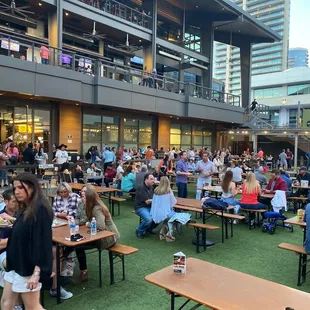 a large group of people eating and drinking