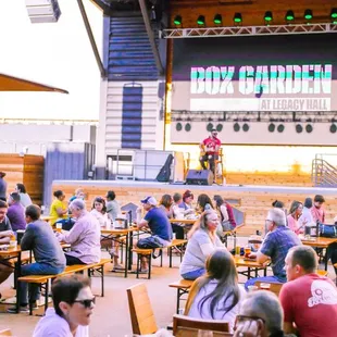 a large group of people sitting at tables