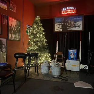 a christmas tree in the corner of the room