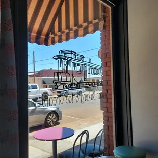 a view of a street through a window