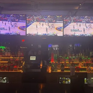 a basketball game on a big screen