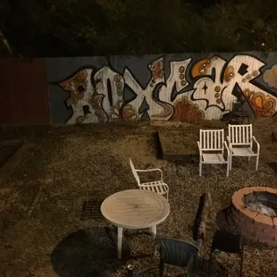 a backyard area with a fire pit