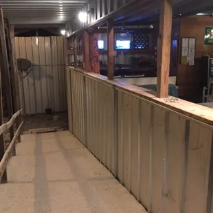 the inside of a barn with a bar