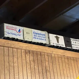 Box cars painted with local businesses