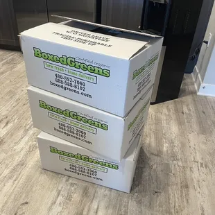 three boxes stacked on top of each other