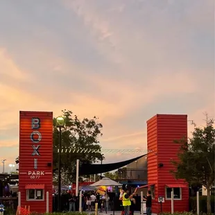 a red building with a sign that says boxi park