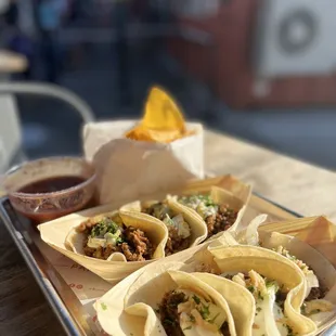 a tray of tacos and chips