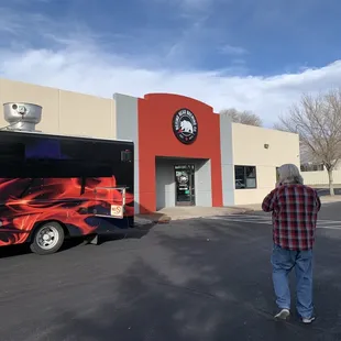 a man standing in front of a bus