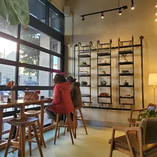 Roll up floor-to-ceiling windows create quite an open space.