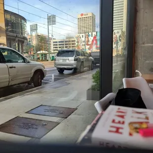 a view of a city street through a window